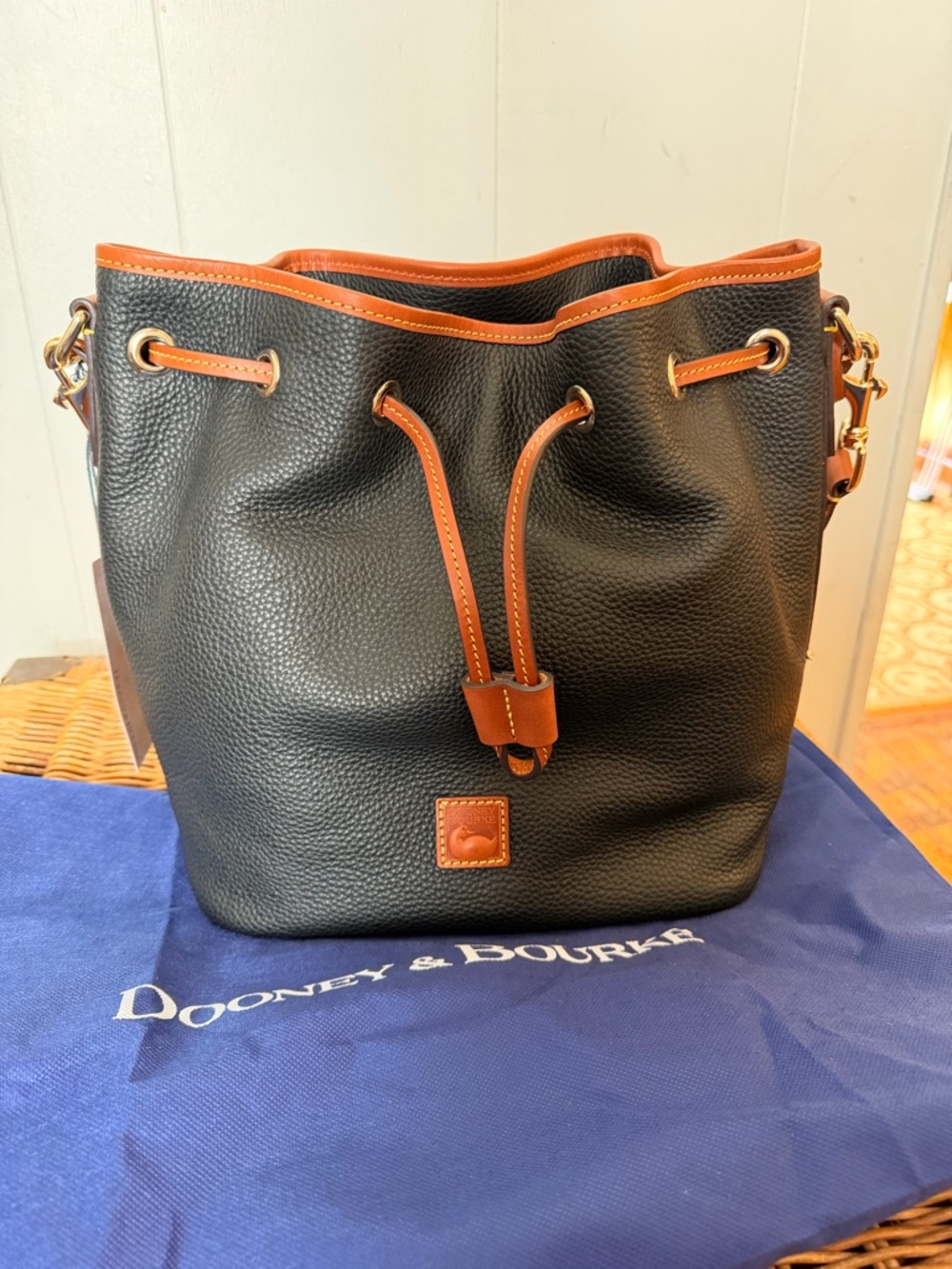 Dooney & Bourke Black Pebble Leather Drawstring Bucket Bag with Brown Trim